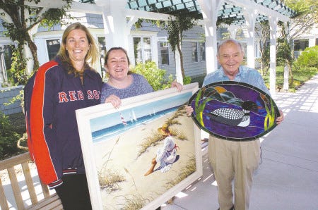 RiverWoods and Squamscott Community Commons are teaming up this year for a fund-raising, auction event on Oct. 4. From left holding some of the items for auction are Robin Drunsic of SCC, Penny Teodorczyk of RiverWoods, and Dick Aplin, resident of RiverWoods.
