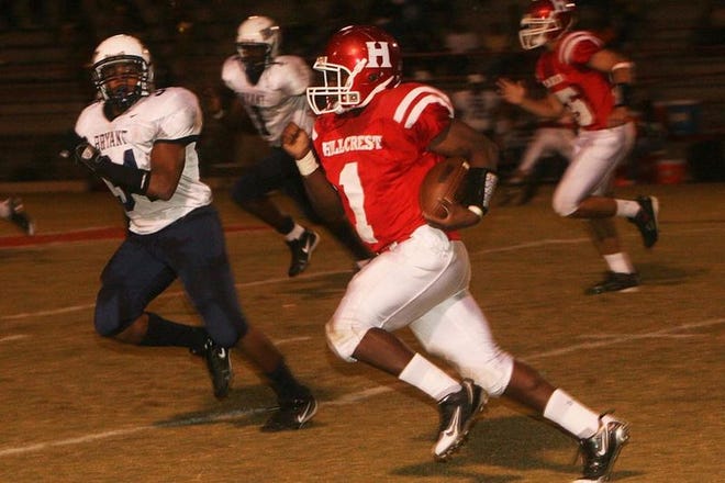 Hillcrest's Ellis Hill (1)attempts to outrun Bryant High School's Quintin Harton (34) Friday October 3, 2008 at Hillcrest in Tuscaloosa, Ala. 
(Michael E. Palmer/Tuscaloosa News)