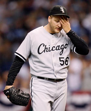 Chicago White Sox pitcher Mark Buehrle reacts after giving up a hit to Tampa Bay Rays' Evan Longoria in the fifth inning during Game 2 of the American League division series baseball game in St. Petersburg, Fla. Friday, Oct. 3, 2008. (AP Photo/Mike Carlson)