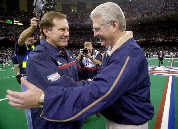 New England Patriots coach Bill Belichick, left, greets then-St. Louis Rams coach Mike Martz during warmups for Super Bowl XXXVI. The coaches meet again today when Belichick's Patriots face the San Fancisco 49ers Sunday. Martz is the Niners' offensive coordinator.