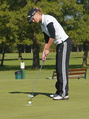 Joe Tamborello / The Journal-Standard     
Emilee Guderyon putts on the first green at Park Hills Golf Course Saturday.