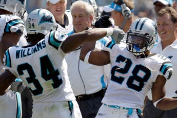 Panthers' DeAngelo Williams (34) and Jonathan Stewart (28) celebrate William's second of his three touchdowns Sunday.