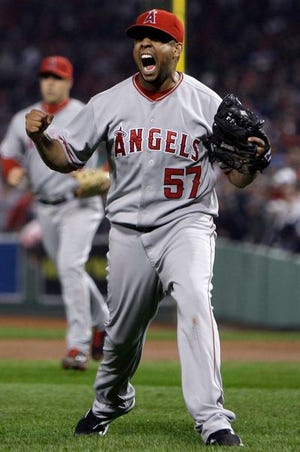 Angels closer Francisco Rodriguez wriggled out of a bases-loaded jam in the 10th inning and Mike Napoli scored the go-ahead run in the 12th to keep Los Angeles alive in its AL division series against the Red Sox.