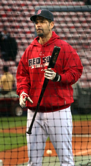 Mike Lowell takes batting practice. After stting out Game 2, he is expected to play Sunday night.
 




GREG DERR
