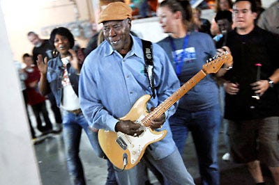 Buddy Guy wends his way through the parking garage on Eighth and Cherry during his headlining performance Saturday at Roots 'N Blues 'N BBQ.