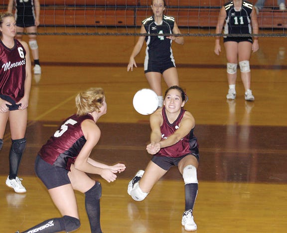 Morenci’s Amy Gillman and Kathleen Barron (5) try to save a ball during Thursday’s TCC?doubleheader against Sand Creek.