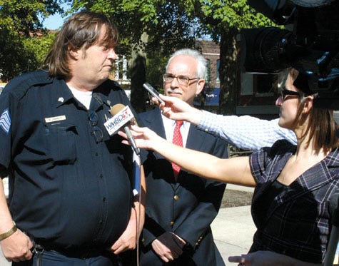 Danny Jarrett, left, president of AFSCME Local 494, and Hank Scheff, director of research for AFSCME Council 31, speak to reporters Wednesday afternoon, after a circuit judge denied a request for a temporary restraining order to stop transfer of inmates from Pontiac Correctional Center.