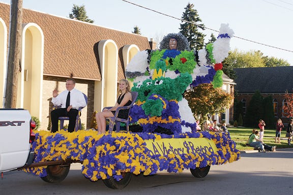 Mitchell Winkelman and Brittany Holdridge, sophomores at Blissfield High School, ride on their class float portraying Disney's Buzz Lightyear during the Blissfield Homecoming Parade on Friday evening.