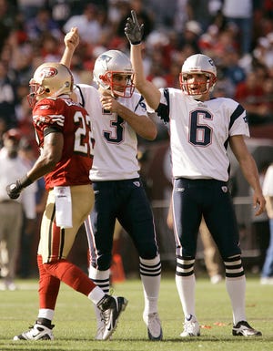 New England Patriots kicker Stephen Gostkowski, middle, and Chris Hanson (6) celebrate Gostkowski's field goal as the 49ers' Nate Clements walks off the field in the fourth quarter last Sunday in San Francisco.