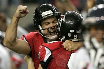 Falcon place kicker Jason Elam, left, celebrates with holder Michael Koenen after kicking a 48-yard field goal as time expired to give the Falcons a 22-20 win over the Chicago Bears.