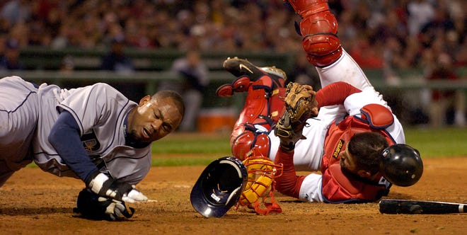 Carl Crawford and Jason Varitek collide at home as Crawford tried to score from third on a grounder, Varitek held on for the tag and out.