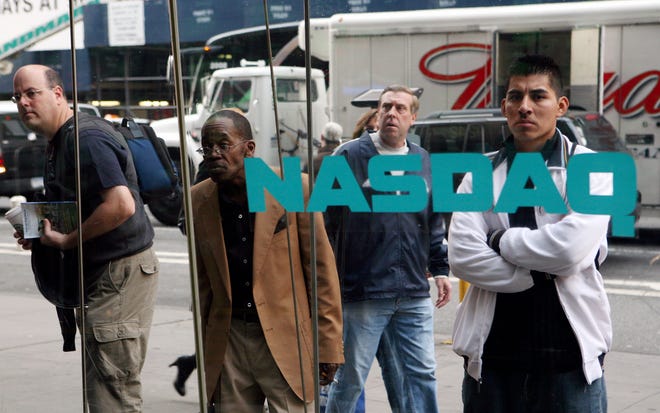** FILE ** In this Oct. 8, 2008 file photo, people look through the windows of the Nasdaq MarketSite Wednesday, Oct. 8, 2008 in New Unlike the last two relatively short recessions, the downturn we are entering could prove much longer and tougher, recalling the anxiety and, to a lesser extent, the severe job losses not seen in many years. (AP Photo/Mark Lennihan, file)
