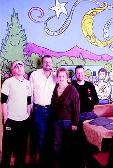 Moondollars Café, a new restaurant in Historic Jackson Square, is one of 20 restaurants participating in the second annual 'Feed the Need' campaign to support ADFAC's efforts with low-income individuals and families in crisis. From left are Shannon Ayers, Chris and Kelly Ayers, and Chef Erik Freeman.