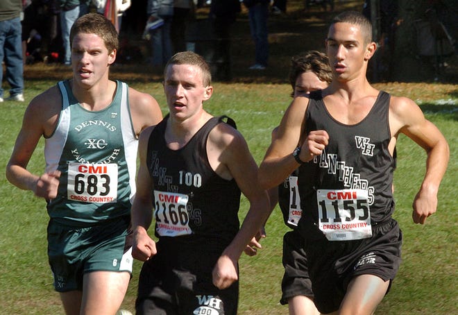 Whitman-Hanson's Pat Taft (1166) and Pat Egan (1155) race toward the finish line with Dennis-Yarmouth's Evan Touhy-Bedford (683) at the Catholic Memorial Invitational on Saturday in Boston.