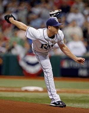 Tampa Bay Rays starting pitcher Scott Kazmir follows through on a throw during the first inning baseball action in Game 2 of the American League championship series in St. Petersburg, Fla., Saturday, Oct. 11, 2008. (AP Photo/Mark Humphrey)