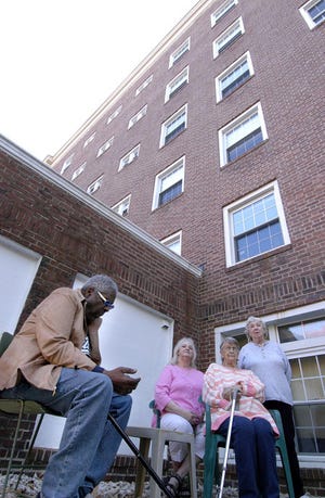 From left, Lenny Ramsey, Rebecca Normaine, Christine Plumer and Belle Nason, tenants in the Portsmouth Apartments, formerly a public housing unit, are concerned about the lack of a working elevator in the six-story building.