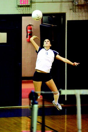 Kelsey Twomey finished off the first game of the Titans rout of Farmington with a jump serve.
