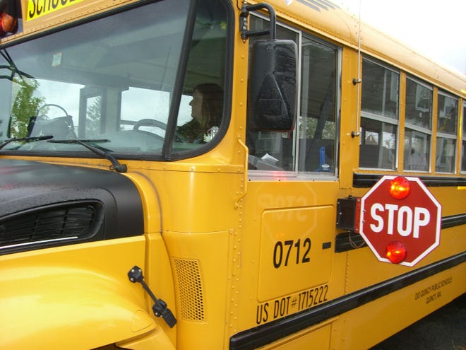 All drivers are required to stop for a school bus with flashing lights or an extended stop sign, including drivers traveling in the opposite direction and those in emergency vehicles.