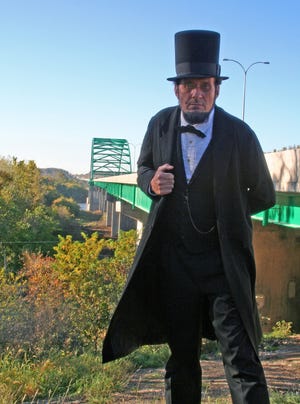 Freeport's own Abraham Lincoln impersonator, George Buss, poses near the Abraham Lincoln Memorial Bridge outside LaSalle on Oct. 16, 2008. Civil Constructors of Freeport recently finished a major rehabilitation of the bridge.