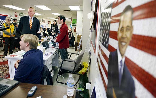 Former Massachusetts Gov. William Weld, a Republican, center background, visits the Barack Obama campaign office in Salem, N.H. Friday, Oct. 24, 2008, where he endorsed Democrat Barack Obama for president.