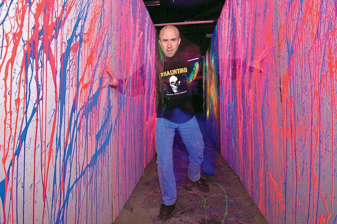 Stuart MacDonald walks through part of 3-Dementia, a 3-D attraction that returns this year to The Haunting, a haunted house located at the Lenawee County Fair and Event Grounds. MacDonald and his wife Lori have been scaring visitors to The Haunting for 14 years.