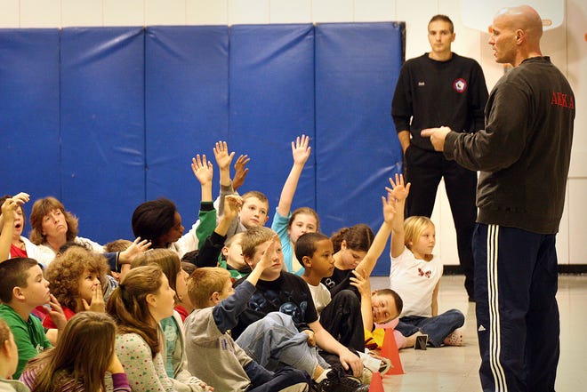 American Kempo Karate Academy instructor Scott Weron talks to Jefferson Elementary School students about avoiding abduction on Monday in Rockland.