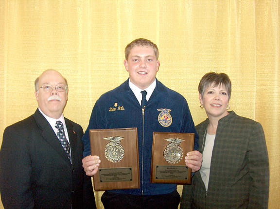 Brian Hills, a member of the Tri-Point FFA Chapter, won a national FFA proficiency award Friday at the National FFA Convention held in Indianapolis, Ind. With him are James Craft, Illinois FFA Executive Secretary, and Diana Loschen, Tri-Point FFA adviser.