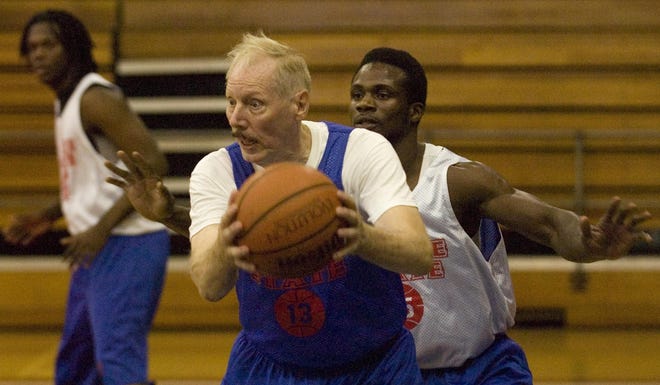 In this Oct. 1, 2008 photo, Roane State basketball player Ken Mink, 73, is guarded by teammate Camille Ngon a’ Ngon during basketball practice at Roane State Community College’s gym in Harriman, Tenn. (AP Photo/Knoxville News Sentinel, Saul Young) ** MANDATORY CREDIT**