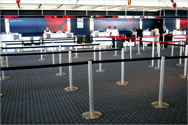 There are no lines at the Delta check-in counter in Cincinnati. The airport added a third runway in 2005, its busiest year.