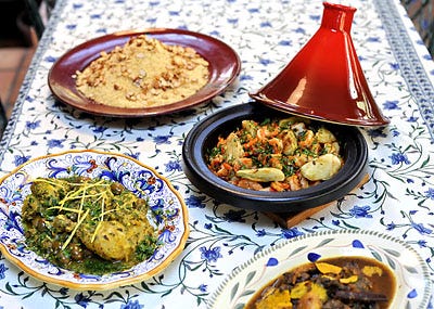 Moroccan dishes made with a tagine include (clockwise from top) couscous, Shrimp Tagine with Ginger and Fennel, classic Lamb Tagine with Almonds, Prunes and Apricots, and Tagine of Chicken with Preserved Lemon and Olives.