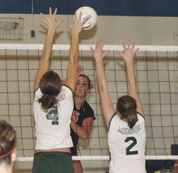 White Pigeons’ Nikki DeMeyer records a kill during the Lady Chiefs win over Mendon Wednesday night.