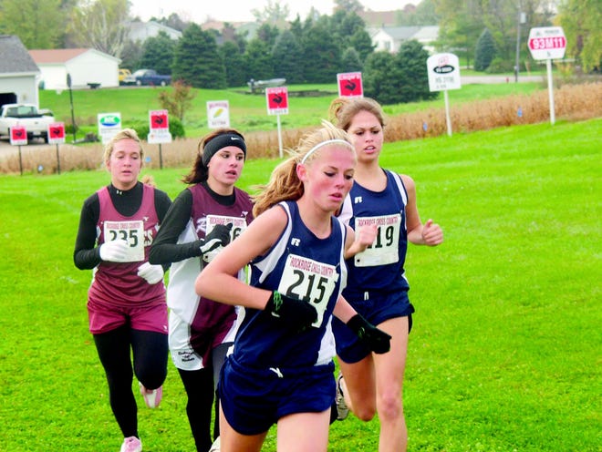 Titans runners Mandy Champion and Marcella Gillen race at the regional.