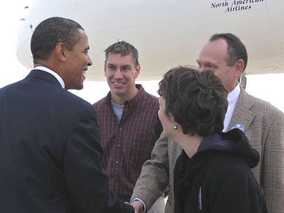 Obama shakes hands with, from left, Kurt Janson, Peter Hinshaw and Jennifer Roberts Oct. 31 at Columbia Regional Airport.