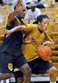 Michael Dixon, here scrimmaging against Missouri's J.T. Tiller during a September open-gym session, signed a letter of intent to play for the Tigers next year. Dixon was a first-team all-state player at Lee's Summit West last year.