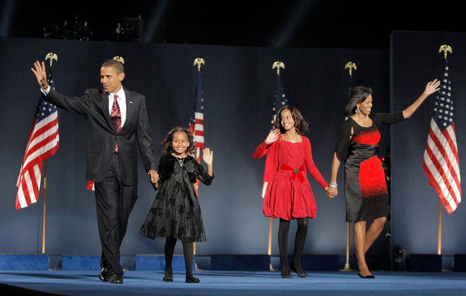 President-elect Barack Obama, left, his wife Michelle Obama, right, and two daughters, Malia, and Sasha, center left.