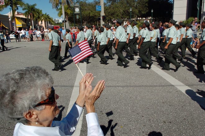 Mary Guarnella watches the Veterans Day parade Tuesday in Sarasota. Junior 
ROTC companies from Sarasota, Booker and Riverview high schools took part. 
Sarasotan Dorothy Tuccinardi's son, now on Navy active duty, is a graduate 
of the JROTC program at Sarasota High. She urges readers to visit shsjrotc.net to learn more about the program.