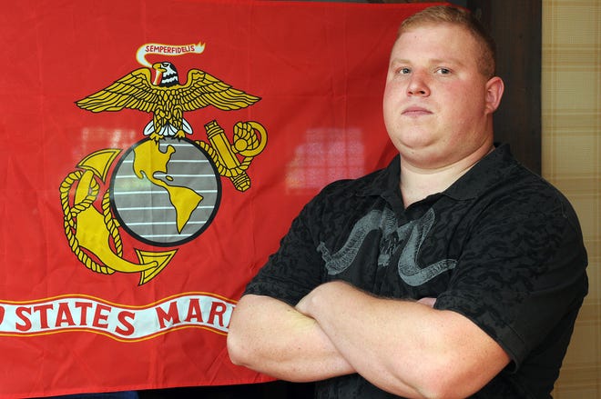 U.S. Marine Corps Sgt. Sven Mozdiez is recovering from a leg injury he suffered in Iraq at his home in Holliston.