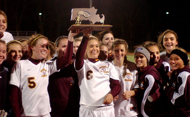 Weymouth players celebrate with their trophy after their 2-1 victory over Norwood on Sunday night in the Div. 1 South Sectional championship game.