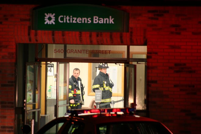 Police investigate the robbery of the Citizens Bank at 540 Granite St. in Braintree early Monday morning.