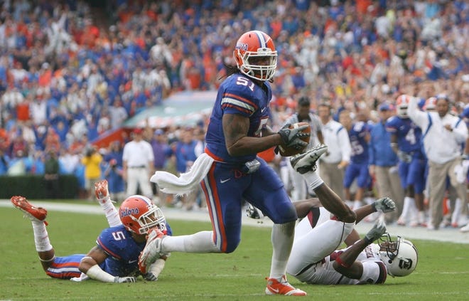 Florida linebacker Brandon Spikes (51) runs back an interception for a 
touchdown that ignited a 21-point first quarter against South Carolina on 
Saturday in Gainesville. The Gators have outscored opponents by a combined 
101-0 during the first quarters of the last six games.