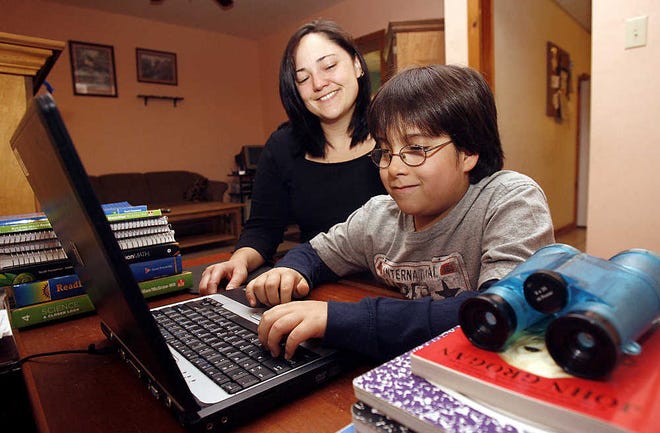 Janice Kraser sits next to her 9-year-old son, Billy Kraser, at their Scranton, Pa., home. Billy has spina bifida and has undergone an experimental surgery which reroutes his nerves in attempt to attain normal bladder and bowel function.