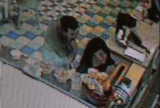 Security cameras caught two thieves going through purses during a fashion 
show. They stole money, keys and cell phones from the amateur models.