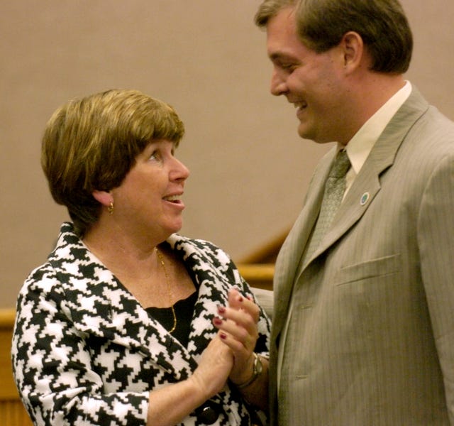 Newly elected Charlotte County commissioner Robert Skidmore, right, and re-elected commissioner Tricia Duffy greet one another before they are sworn into office at the Charlotte County Administration Center on Tuesday .