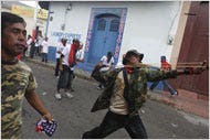 Supporters of the left-wing Sandinista party of President Daniel Ortega threw stones during a clash on Sunday in León.