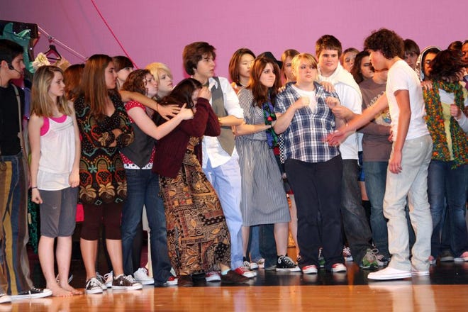 Photos by MAGGIE FITZROY/StaffNease and Ponte Vedra high schools' drama students rehearse a Godspell scene with lead Matt Young (right) as Jesus.