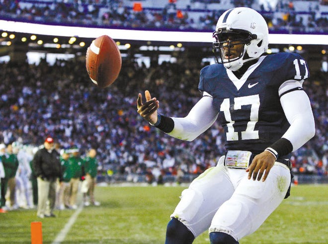 Penn State quarterback Daryll Clark flips the ball after scoring touchdown Saturday.