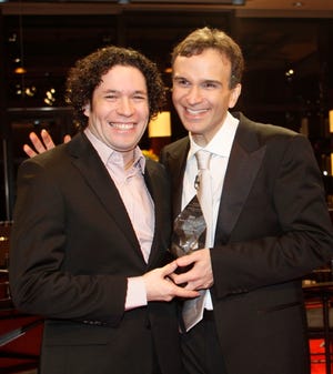 AP PHOTO
Conductor Gustavo Dudamel, left, presents the 2008 Avery Fisher Prize to 
friend and colleague violinist Gil Shaham during a PBS broadcast performance 
 Thursday at Lincoln Center in New York.