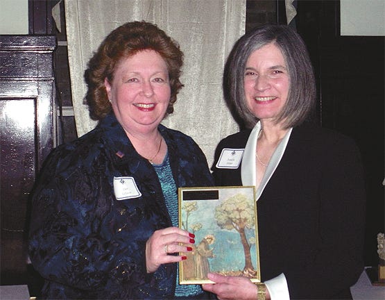 St. Elizabeth Hospital President and CEO Dee LeJeune, left, receives the 2008 Distinguished Alumni Award from Our Lady of the Lake College President Sandra Harper.