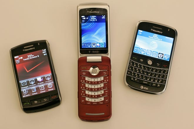 Left to right, the new offerings from Research in Motion Ltd.: BlackBerry Storm, BlackBerry Pearl Flip 8220, and a BlackBerry Bold 9000.