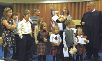 Paul and Wendy Shank recently became the proud parents of 11 children, ages 2 through 14, after they adopted a family member’s four children this fall. The Shank family was one of five featured Tuesday at Adoption Day ceremonies at St. Joseph County Probate Court.